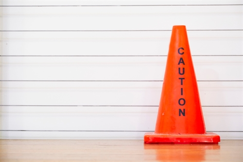 A red cone with caution written on it